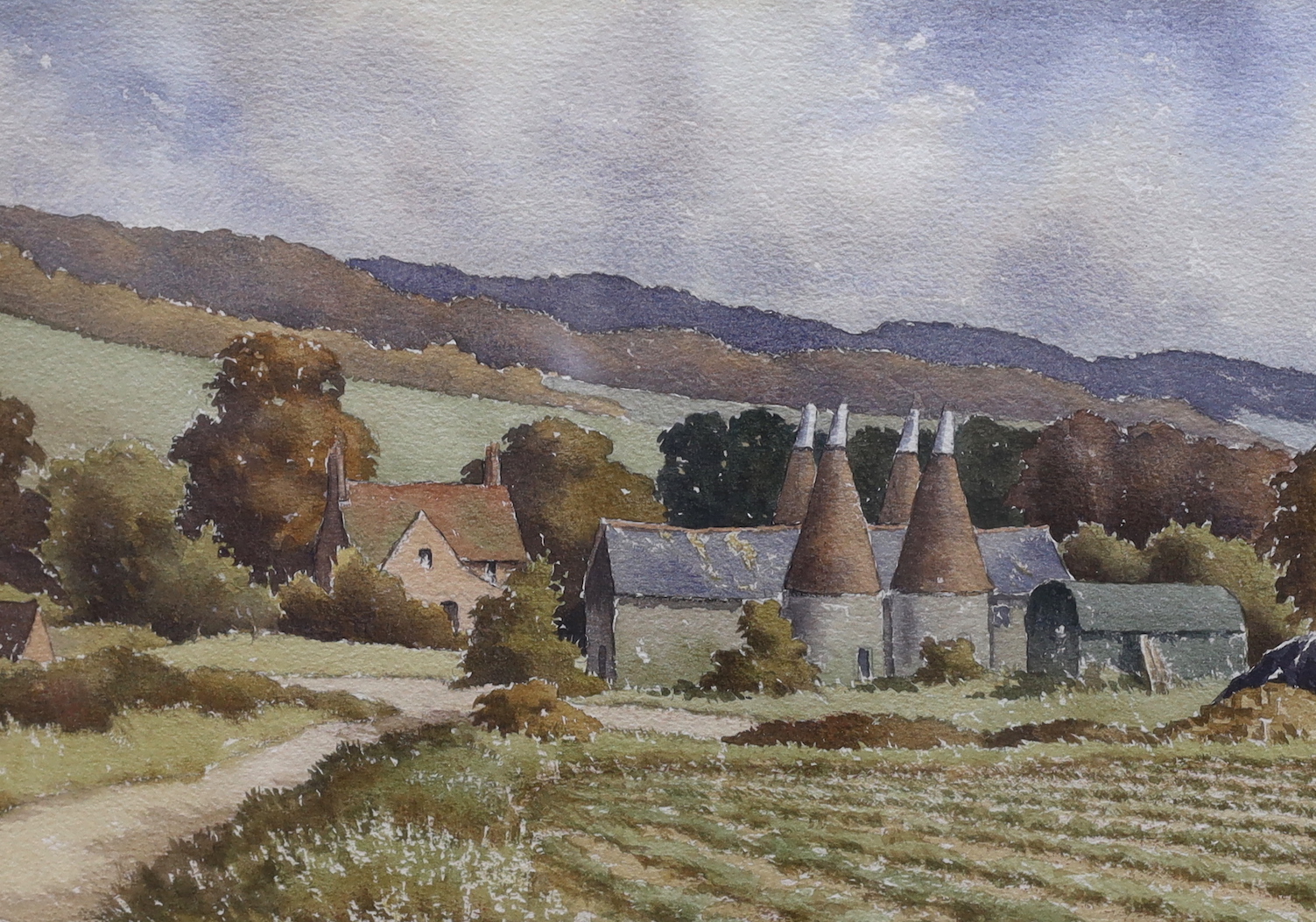 Ray Campbell-Smith (1916-2016), watercolour, 'Oast houses and furrowed field, Kent', initialled, 26 x 35cm together with Arthur Miles (1905-1987), watercolour, 'The Workshop', signed and dated 1969, 31 x 46.5cm